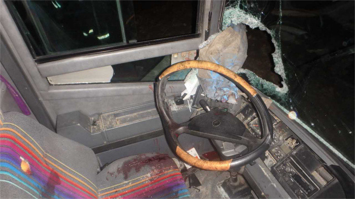 Metal rod flung from passing truck impales bus driver
