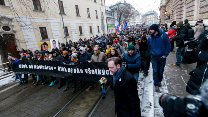 Thousands of people march for murdered journalist