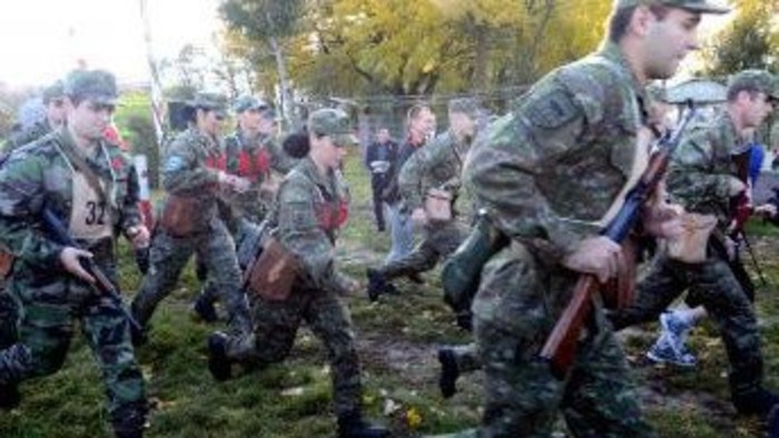Soldiers and the public run together