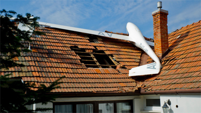 Aircraft flies into house following mid-air collision