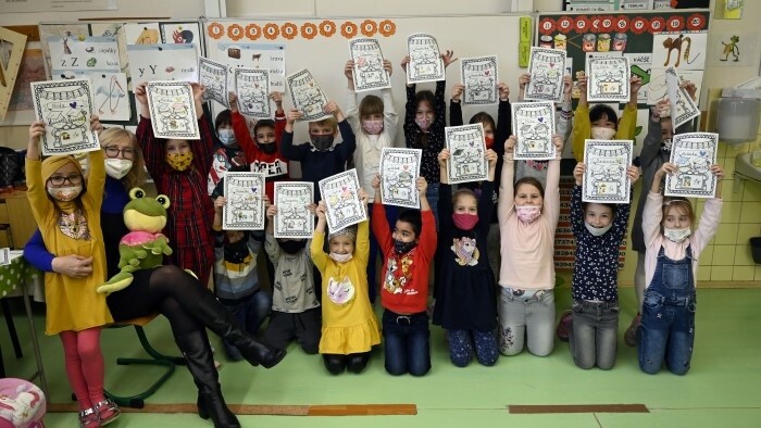 Slovak students collect their report cards on Monday